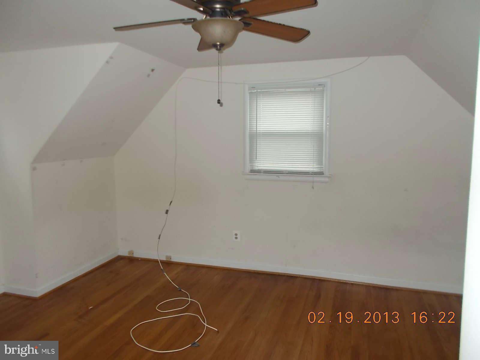 3302 Harrell Street Silver Spring, MD 20906 - Photo 10 of 18 an empty room with a ceiling fan and carpet