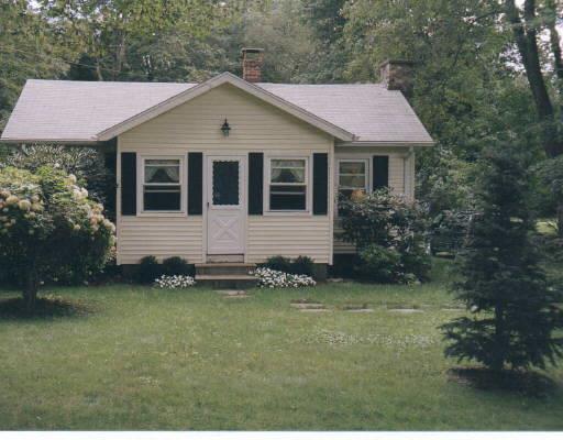 27 Seeley Road Wilton, CT 06897 - Photo 1 of 1 a front view of a house with a garden