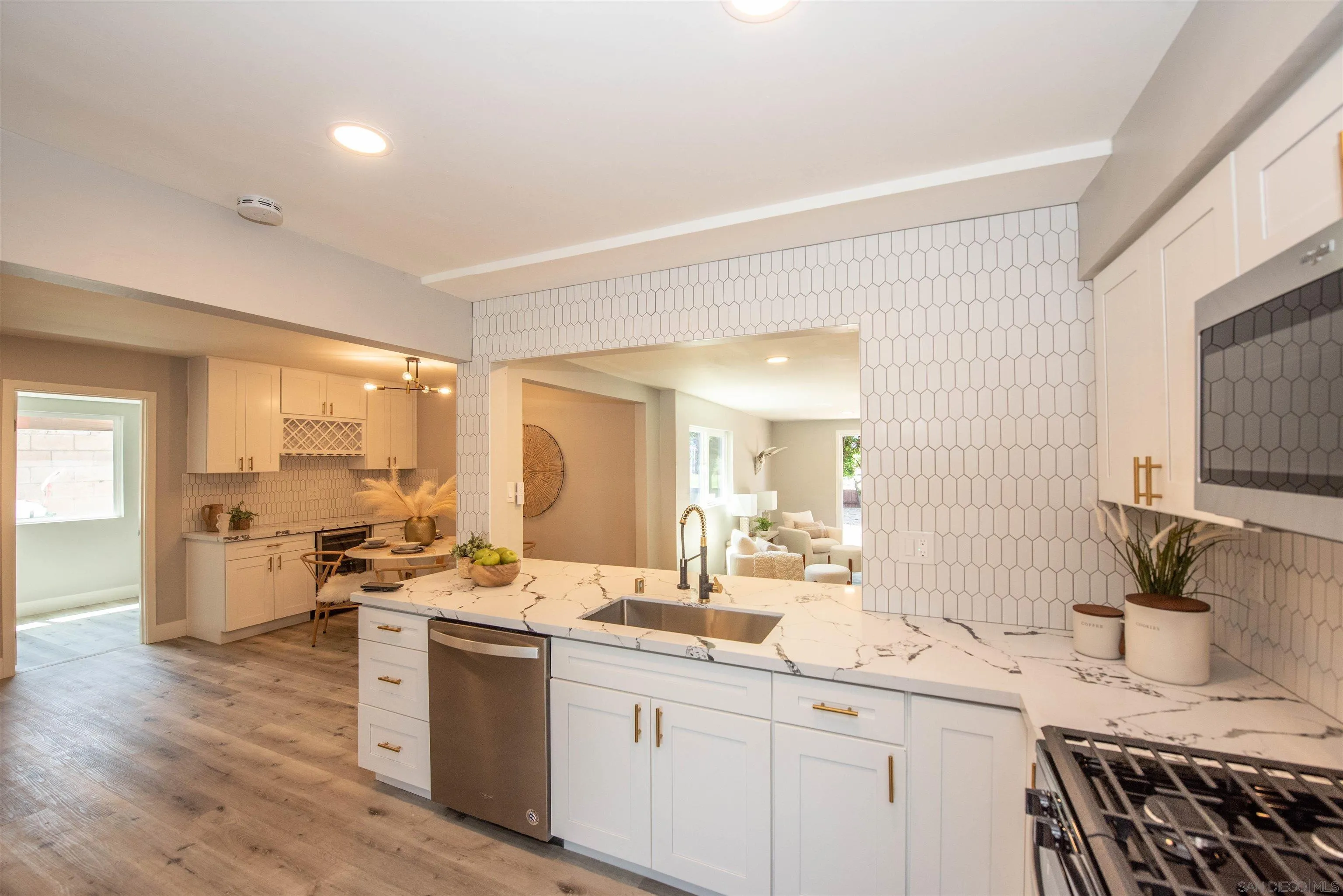 101 Monroe Street Oceanside, CA 92057 - Photo 11 of 40 a large kitchen with a lot of counter space and wooden floor
