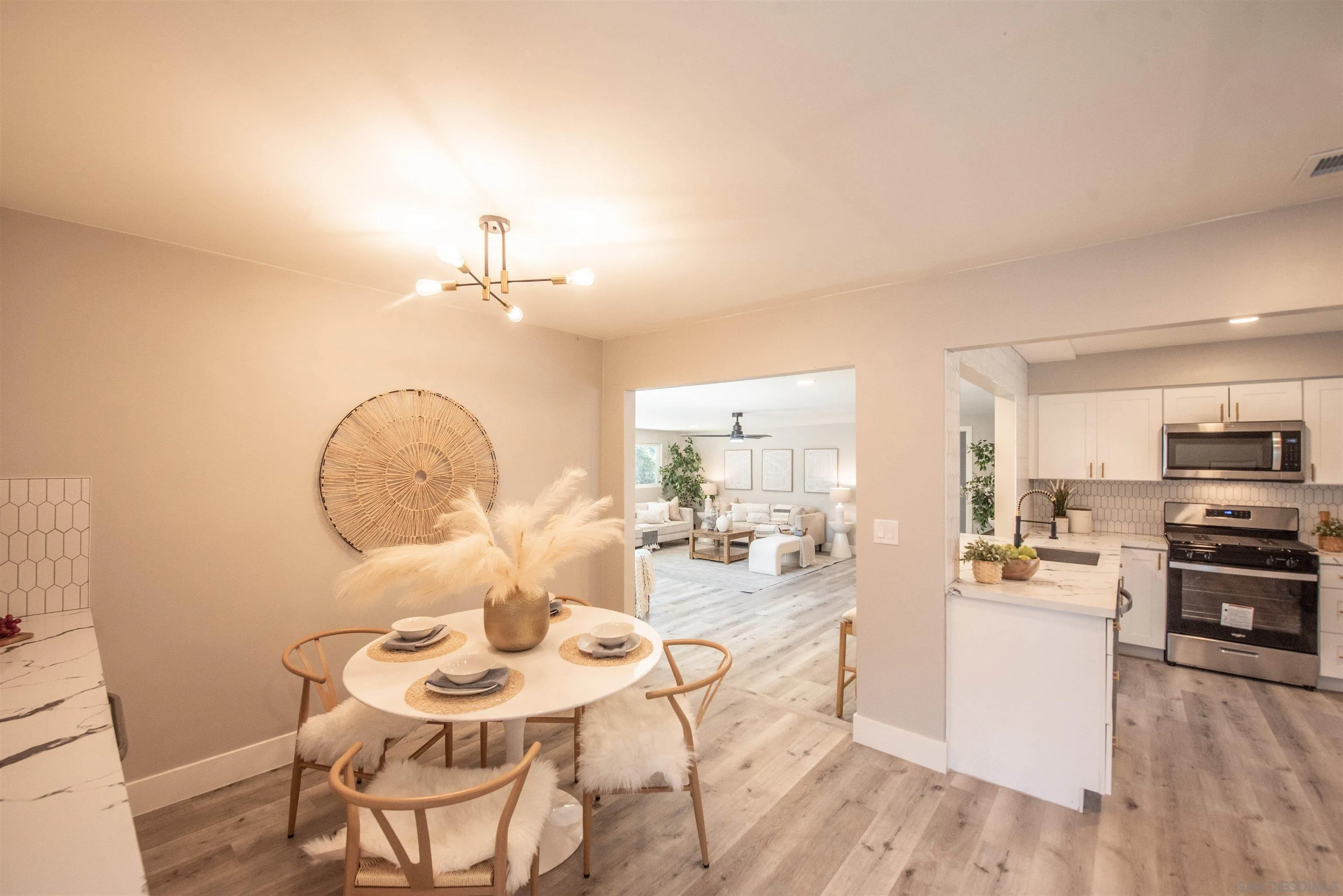 101 Monroe Street Oceanside, CA 92057 - Photo 14 of 40 a living room with stainless steel appliances kitchen island granite countertop a table and chairs in it