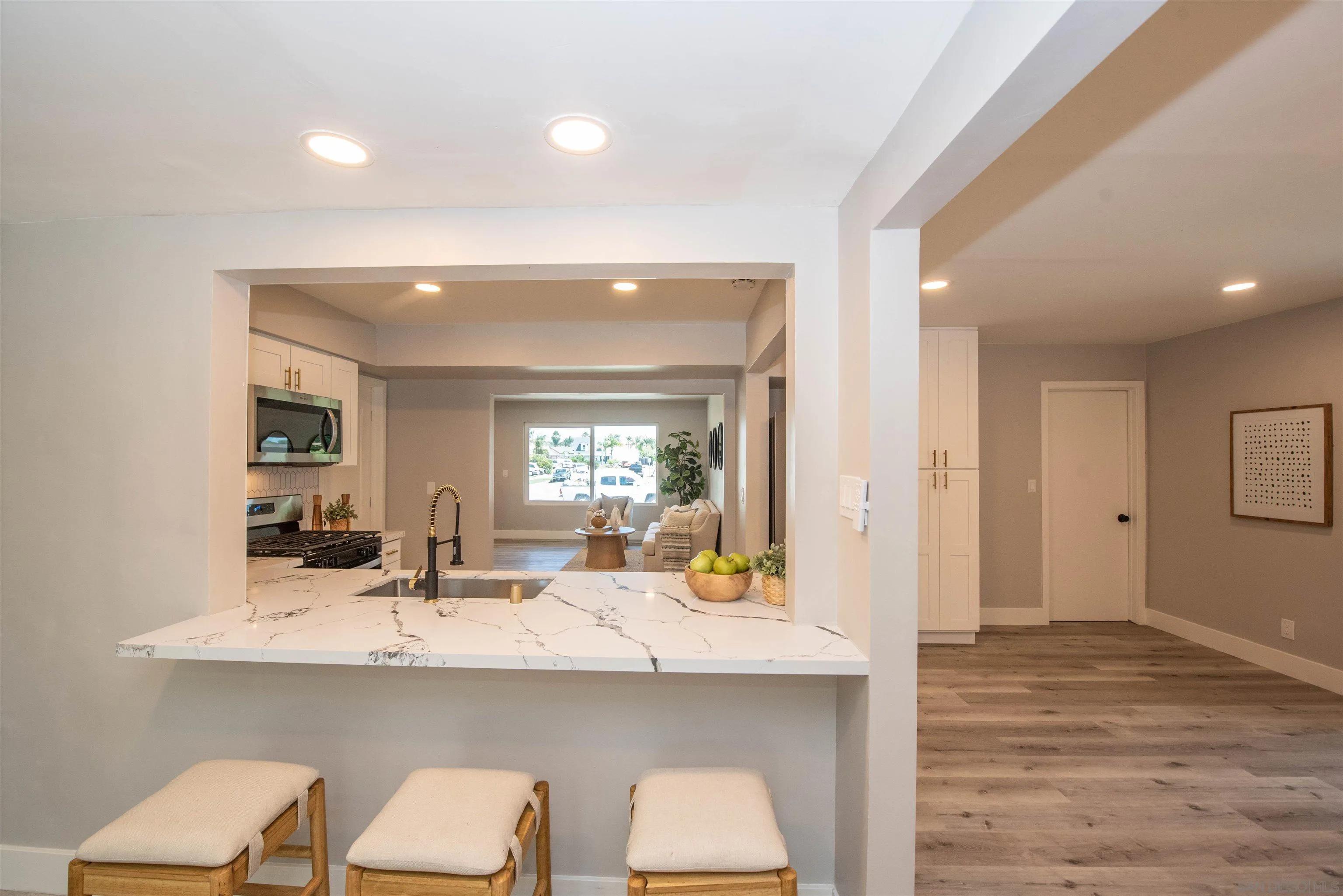 101 Monroe Street Oceanside, CA 92057 - Photo 15 of 40 a bathroom with a sink and a mirror with chair