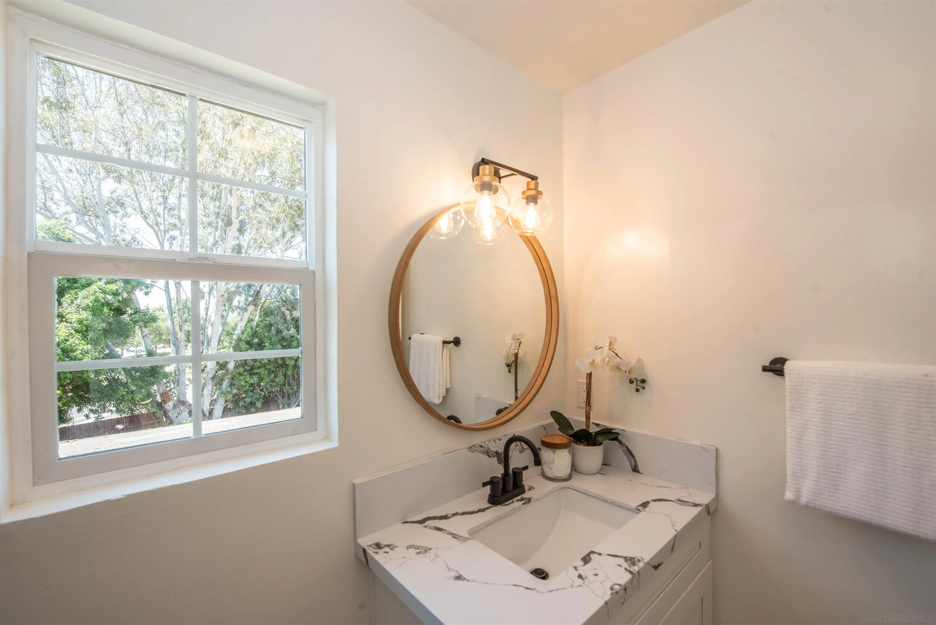 101 Monroe Street Oceanside, CA 92057 - Photo 30 of 40 a bathroom with a sink mirror and a window