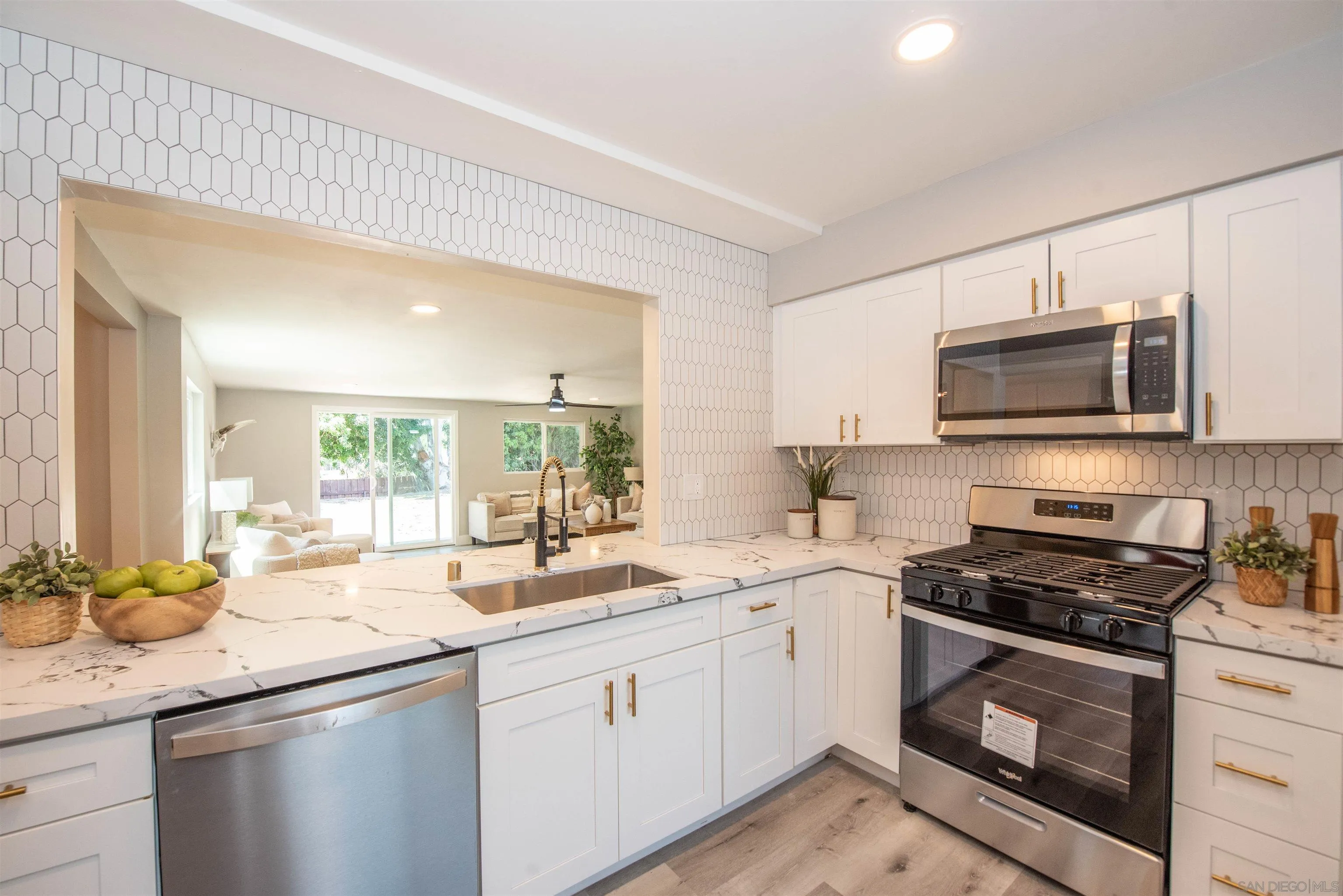 101 Monroe Street Oceanside, CA 92057 - Photo 3 of 40 a kitchen with granite countertop a sink and steel appliances