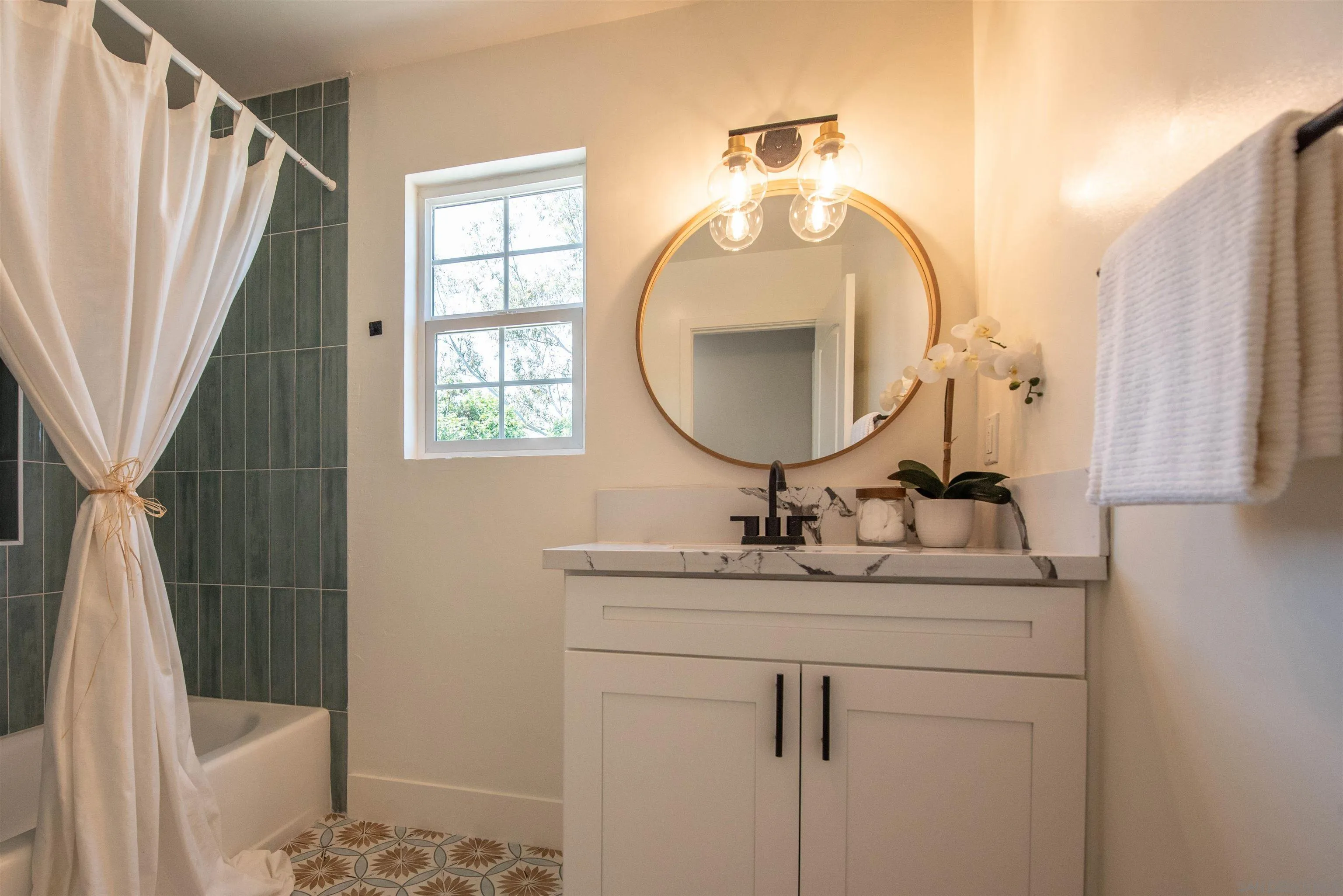 101 Monroe Street Oceanside, CA 92057 - Photo 31 of 40 a bathroom with a sink mirror vanity and toilet