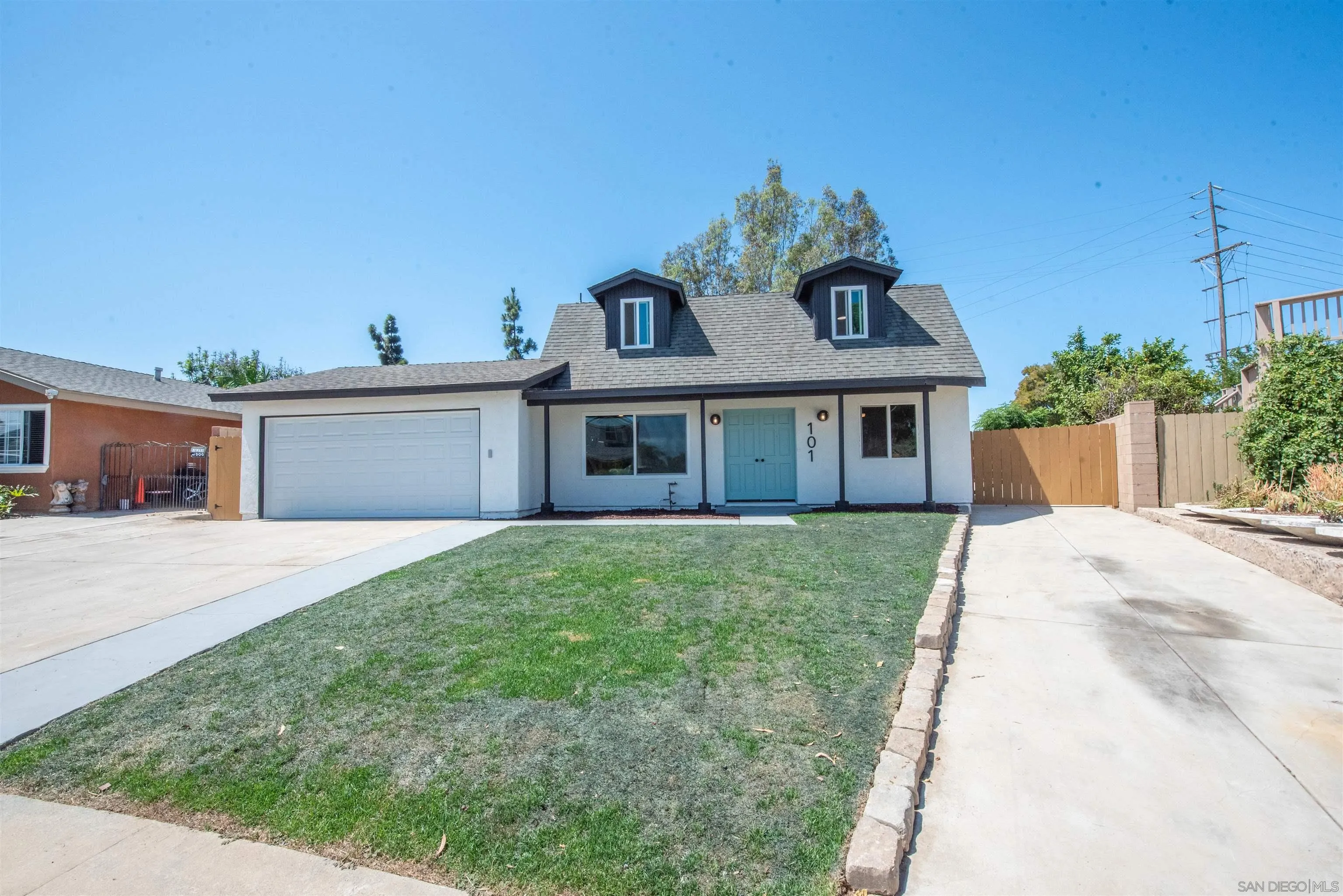 101 Monroe Street Oceanside, CA 92057 - Photo 36 of 40 a front view of a house with a yard and garage