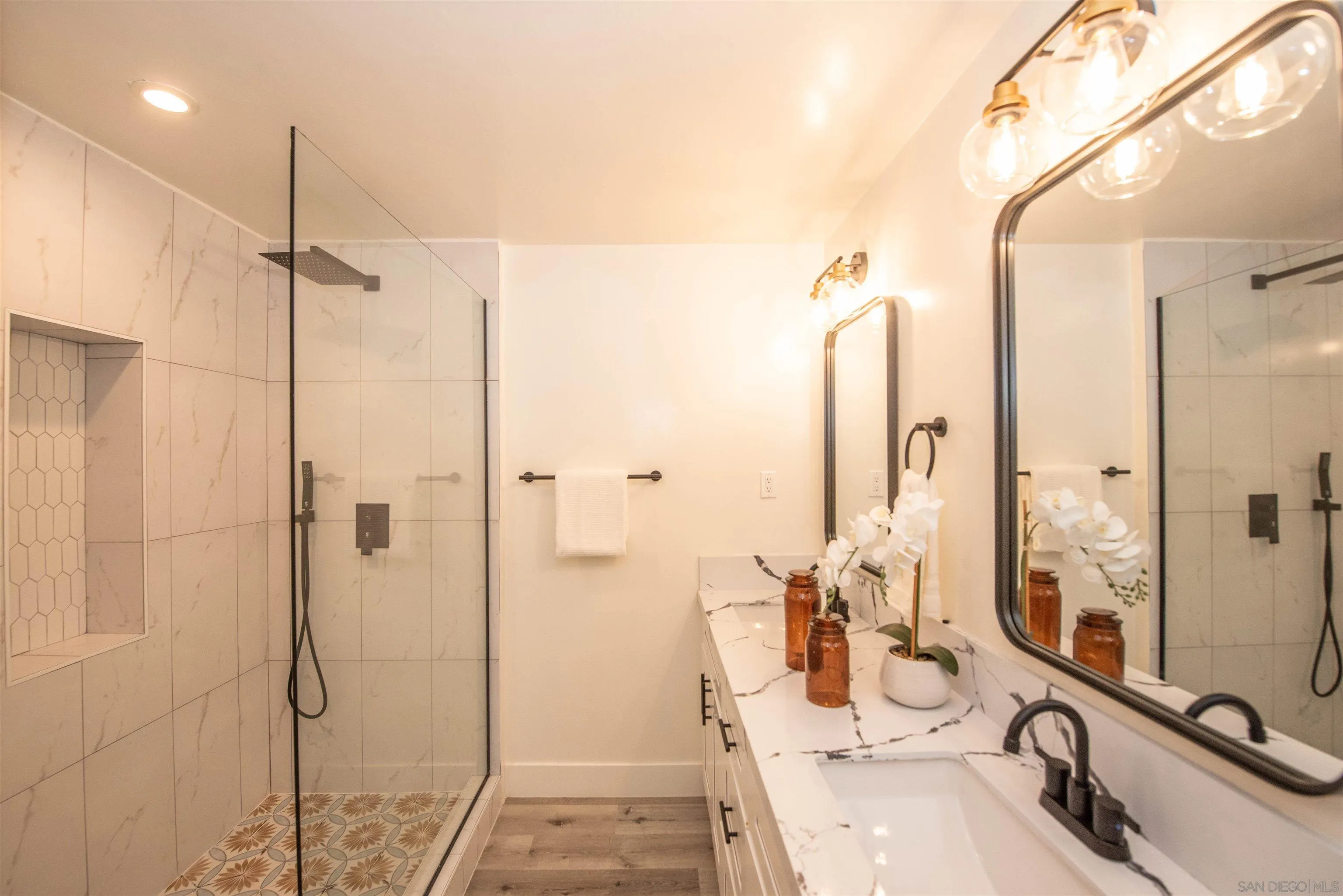 101 Monroe Street Oceanside, CA 92057 - Photo 5 of 40 a bathroom with a double vanity sink and glass door with glass windows