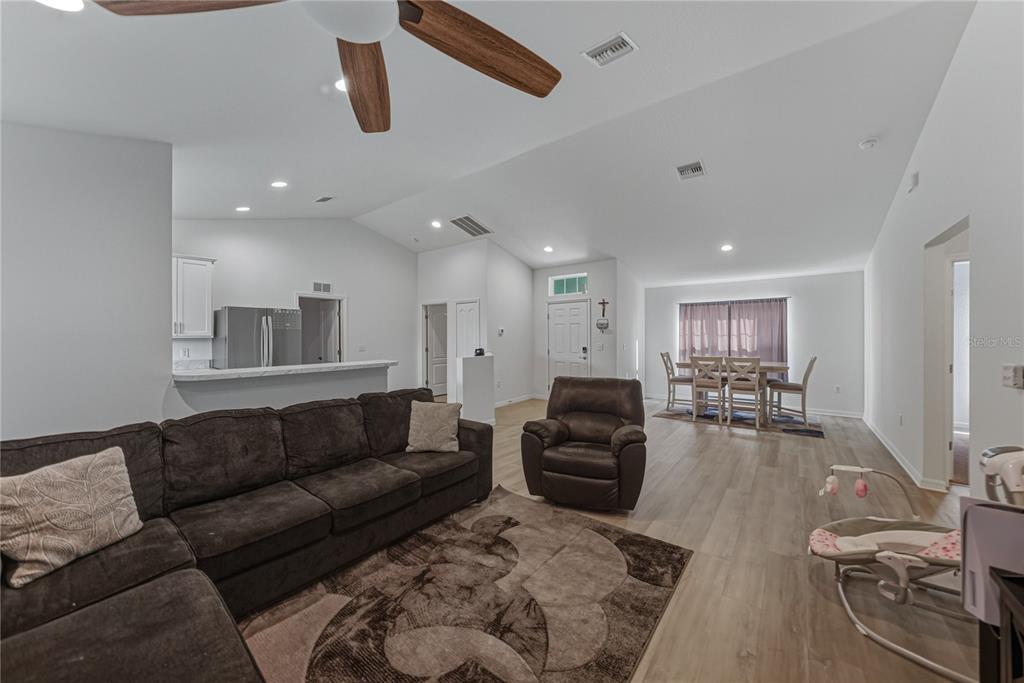 4514 Adrienne Street Sebring, FL 33872 - Photo 19 of 55 a living room with furniture or couch and a wooden floor