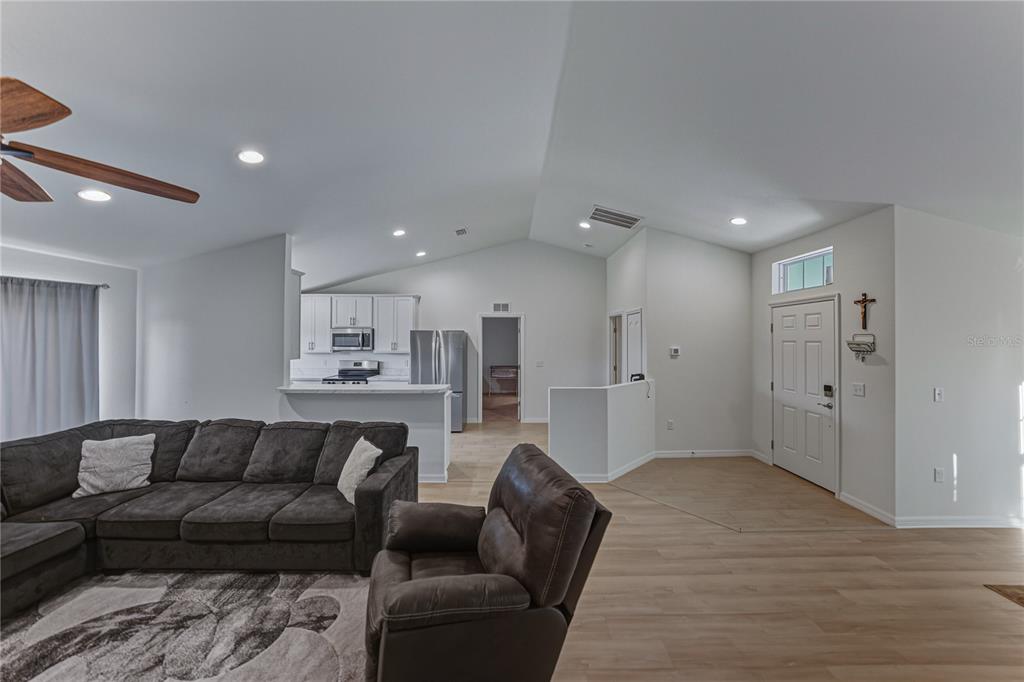 4514 Adrienne Street Sebring, FL 33872 - Photo 20 of 55 a view of kitchen with furniture and wooden floor