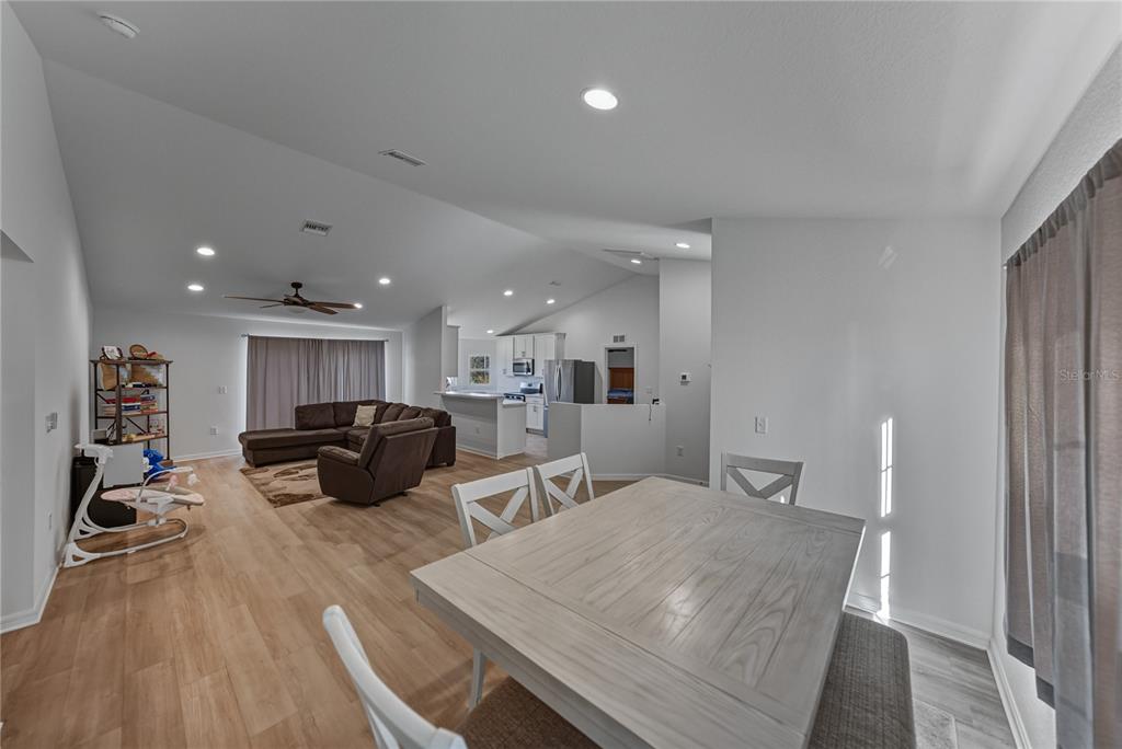 4514 Adrienne Street Sebring, FL 33872 - Photo 22 of 55 a living room with furniture and a wooden floor