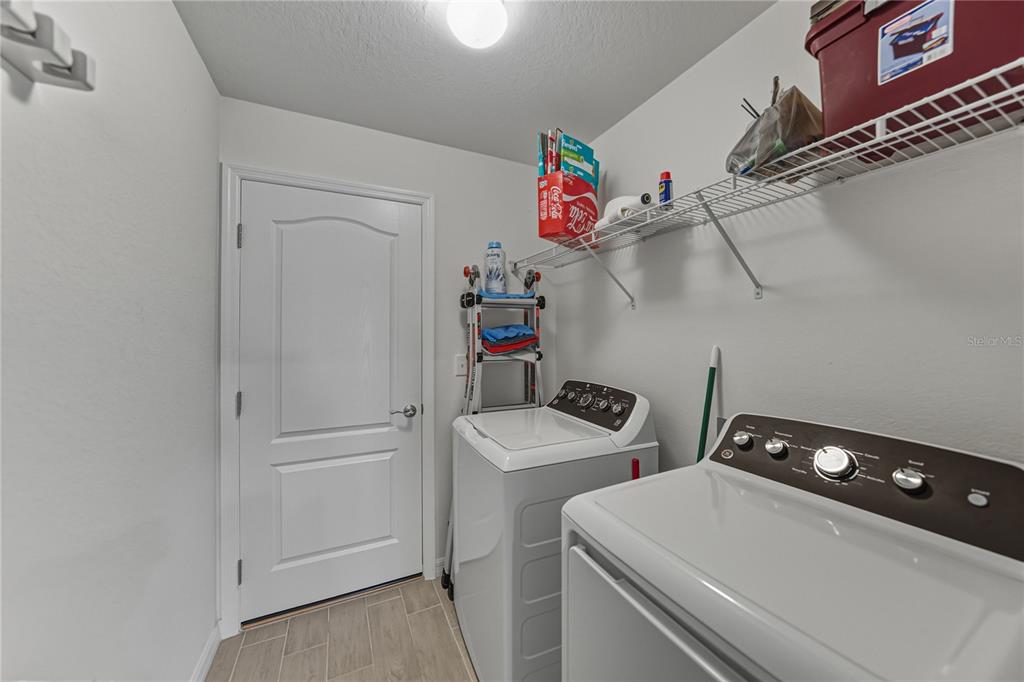 4514 Adrienne Street Sebring, FL 33872 - Photo 30 of 55 a utility room with dryer and washer