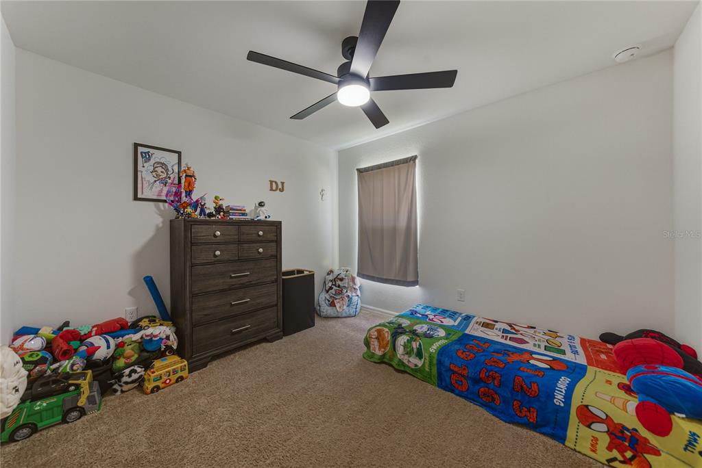 4514 Adrienne Street Sebring, FL 33872 - Photo 40 of 55 a bedroom with a bed and cabinets