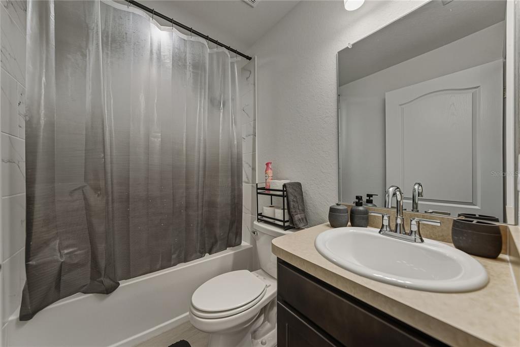 4514 Adrienne Street Sebring, FL 33872 - Photo 43 of 55 a bathroom with a granite countertop sink toilet and shower