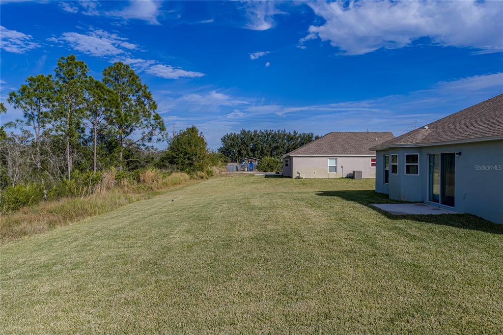 4514 Adrienne Street Sebring, FL 33872 - Photo 47 of 55 a view of a house with a yard