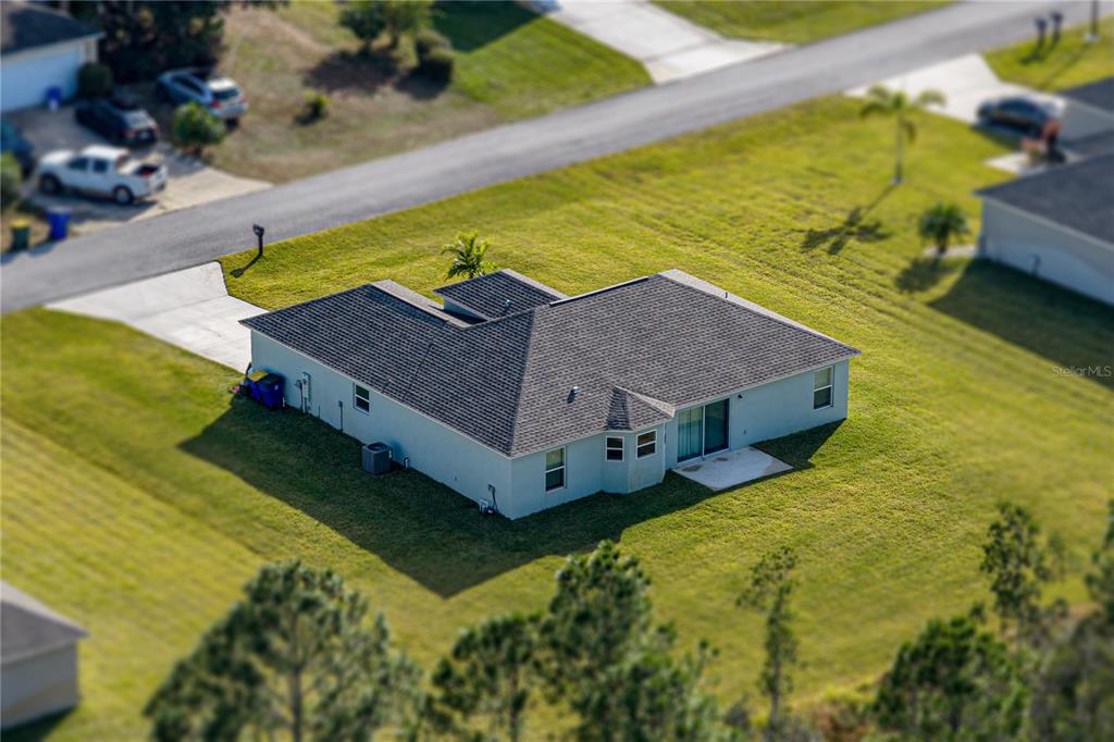 4514 Adrienne Street Sebring, FL 33872 - Photo 8 of 55 a view of a swimming pool with a yard
