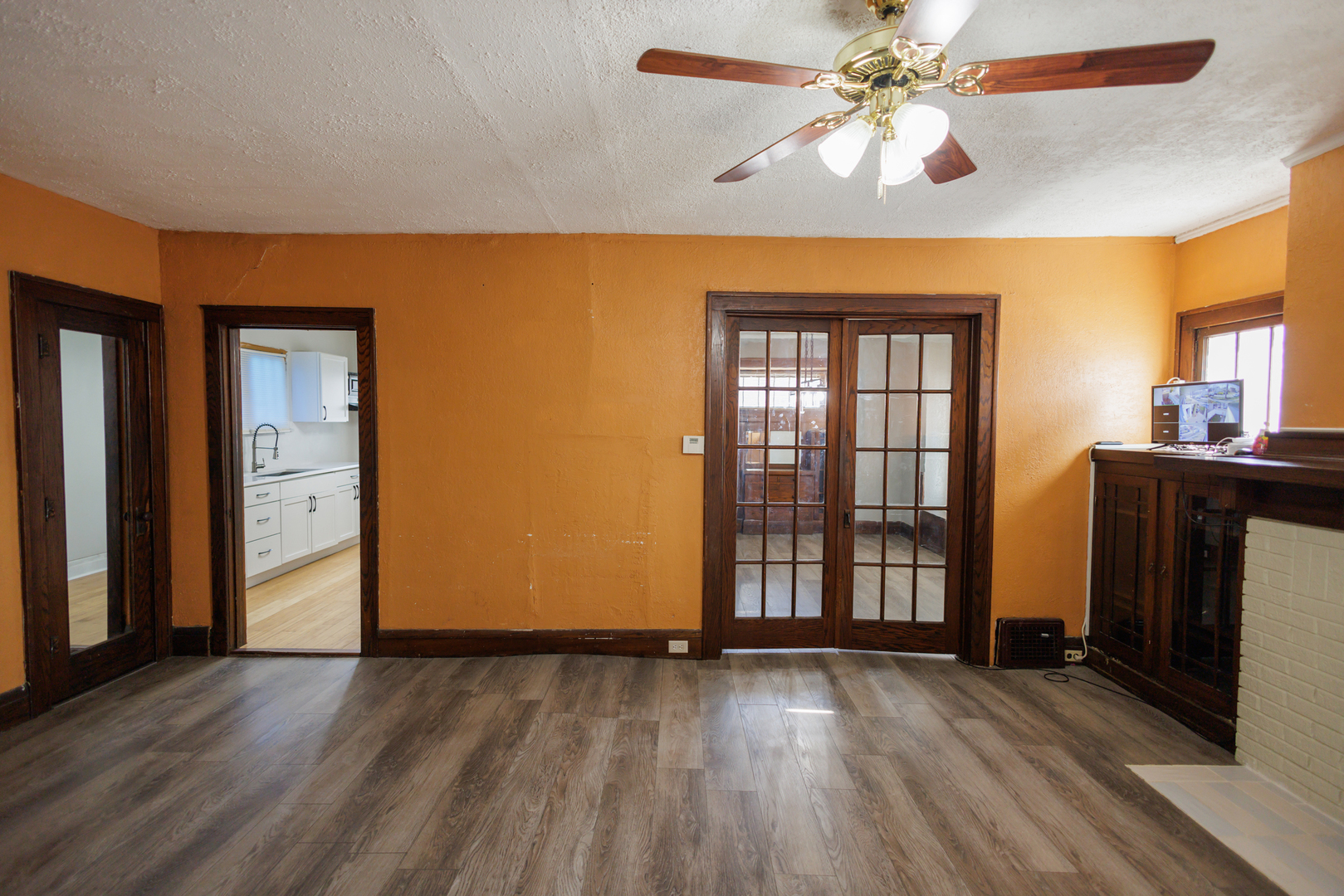 378 South Evergreen Avenue Kankakee, IL 60901 - Photo 11 of 26 a view of an empty room with wooden floor and a window