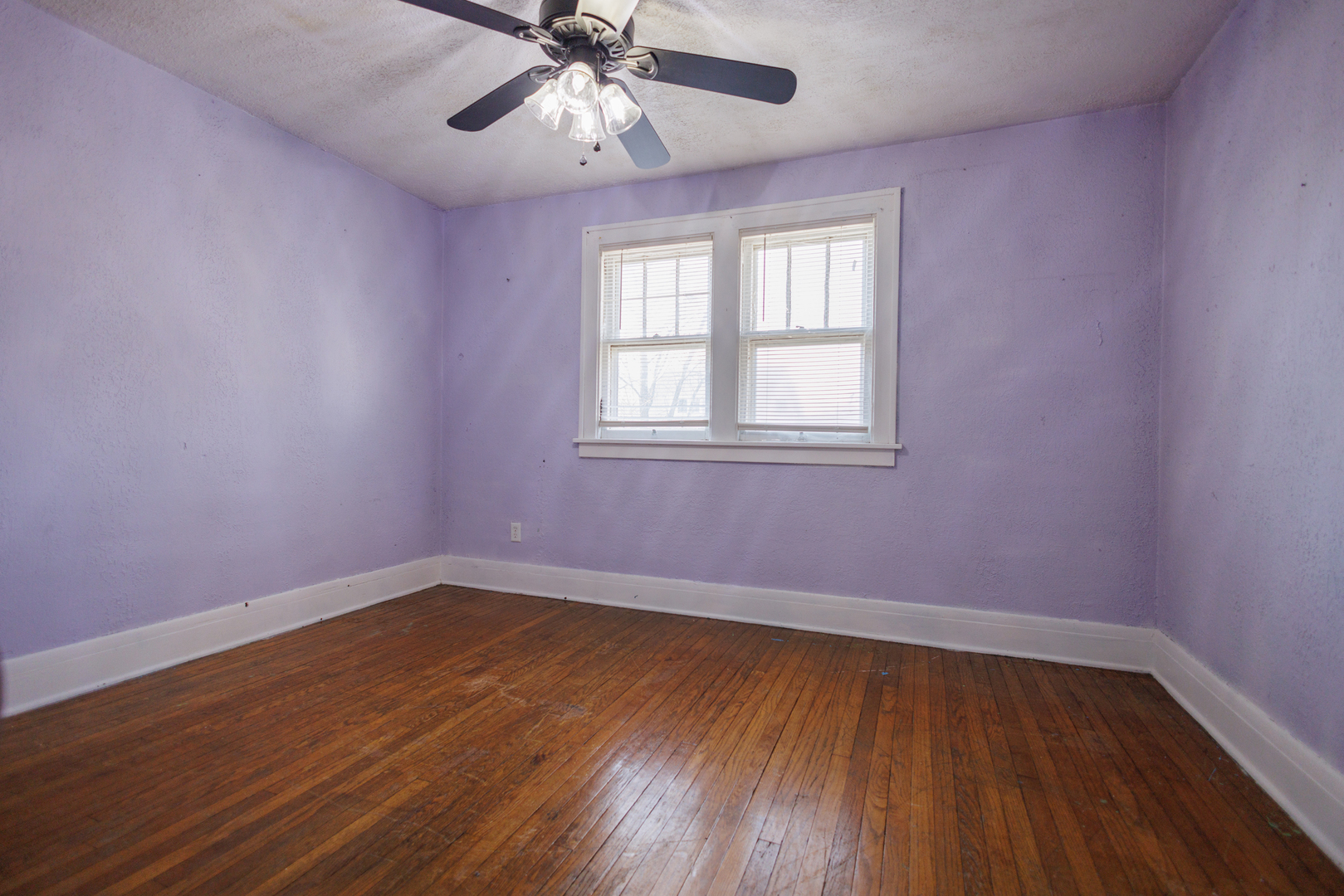 378 South Evergreen Avenue Kankakee, IL 60901 - Photo 14 of 26 a view of an empty room with wooden floor and a window