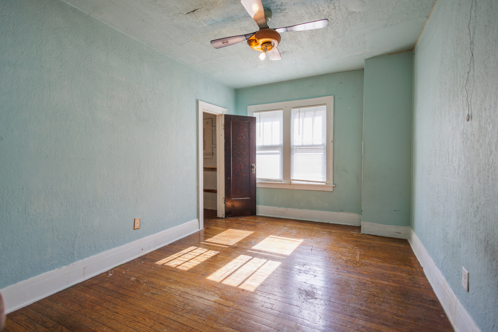 378 South Evergreen Avenue Kankakee, IL 60901 - Photo 15 of 26 wooden floor in an empty room with a window