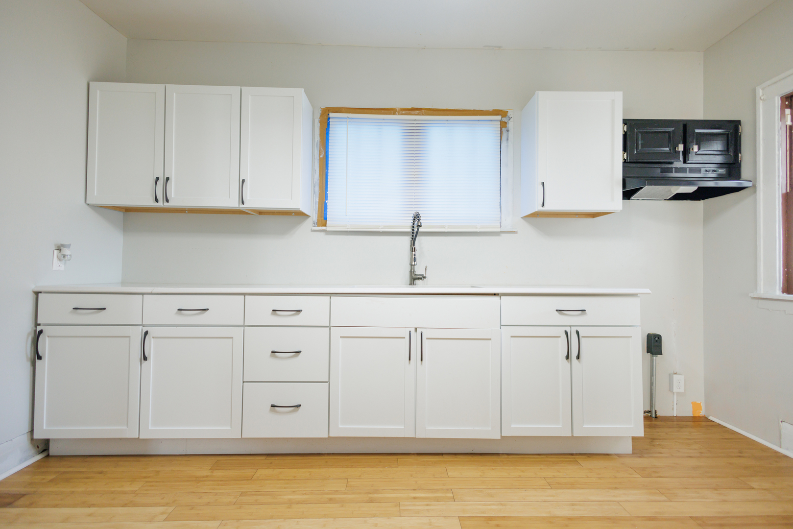 378 South Evergreen Avenue Kankakee, IL 60901 - Photo 3 of 26 a view of a kitchen with white cabinets