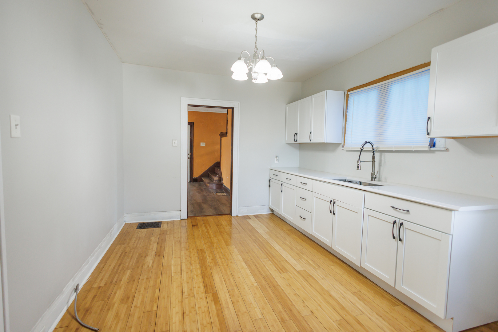 378 South Evergreen Avenue Kankakee, IL 60901 - Photo 4 of 26 a spacious bathroom with a sink and a mirror