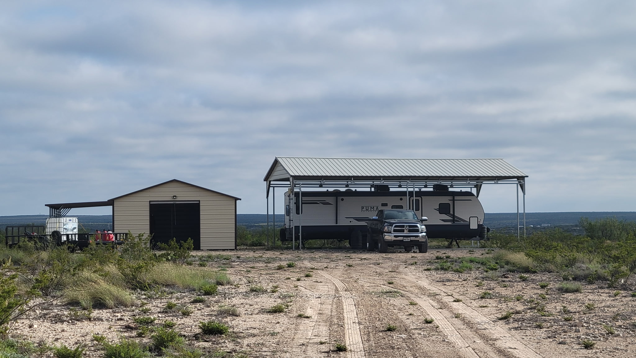 -bendle Rd Bendle Road Dryden, TX 78851 - Photo 1 of 31 A spacious lot features a metal storage building alongside a covered RV carport.