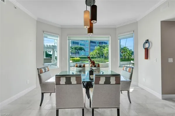 a view of a dining room with furniture and window