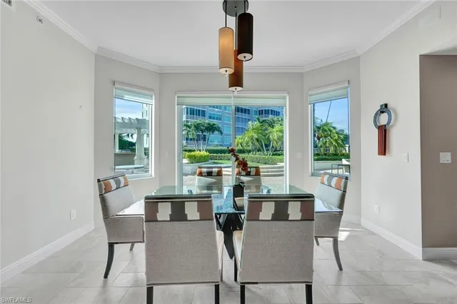 a view of a dining room with furniture and window