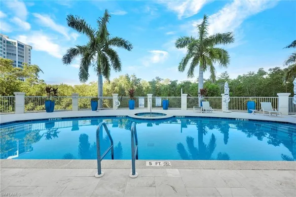 a view of a swimming pool with a patio