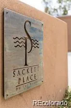 a view of a house with a tree in the background