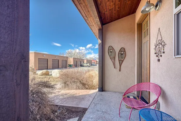 a view of a hallway with furniture and lamp