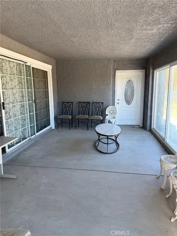 a living room with furniture window and a large window