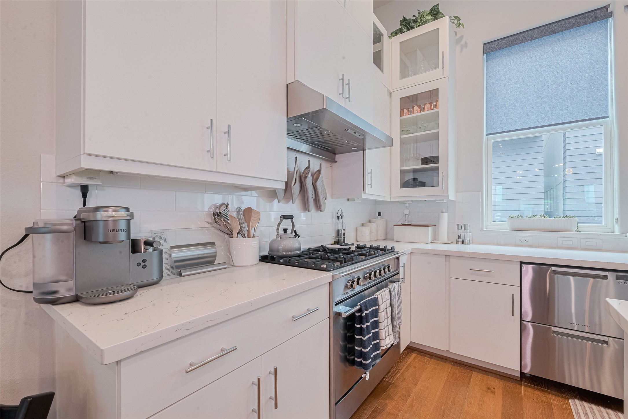 2608 Rusk Street Houston, TX 77003 - Photo 13 of 44 a kitchen with stainless steel appliances granite countertop a sink stove and cabinets