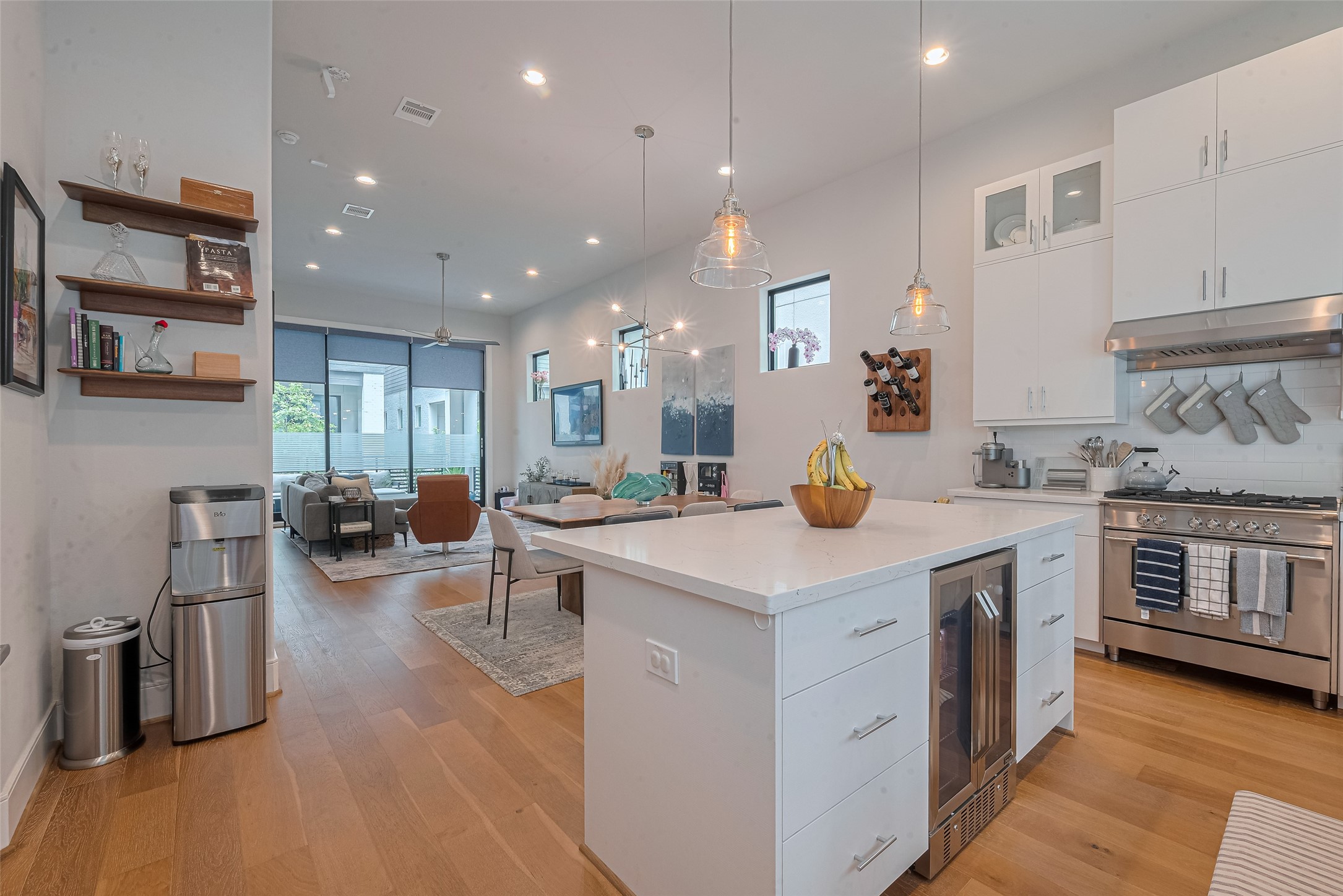 2608 Rusk Street Houston, TX 77003 - Photo 16 of 44 a kitchen with stainless steel appliances granite countertop a lot of counter space and wooden floors