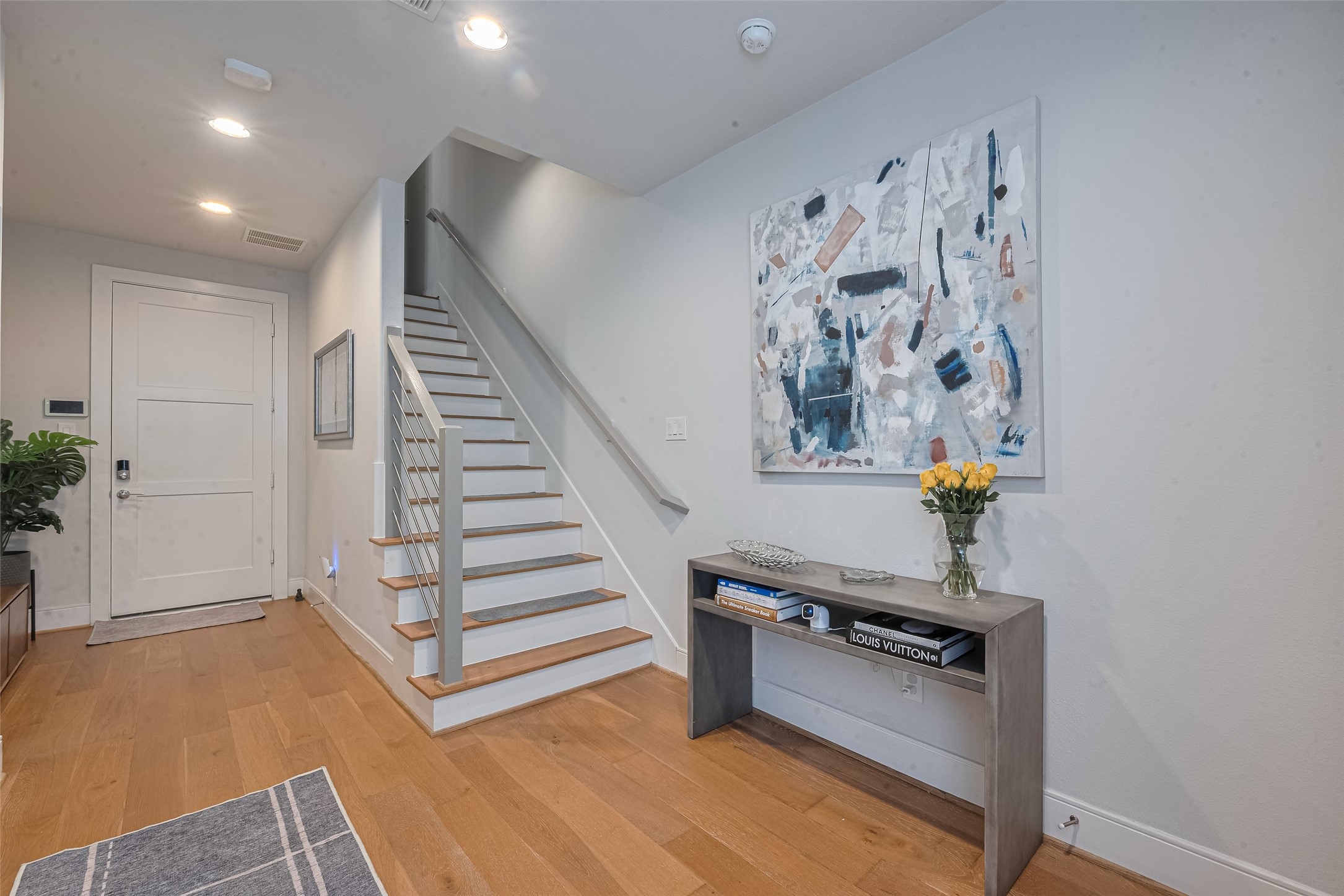 2608 Rusk Street Houston, TX 77003 - Photo 3 of 44 wooden floor with white walls and stairs