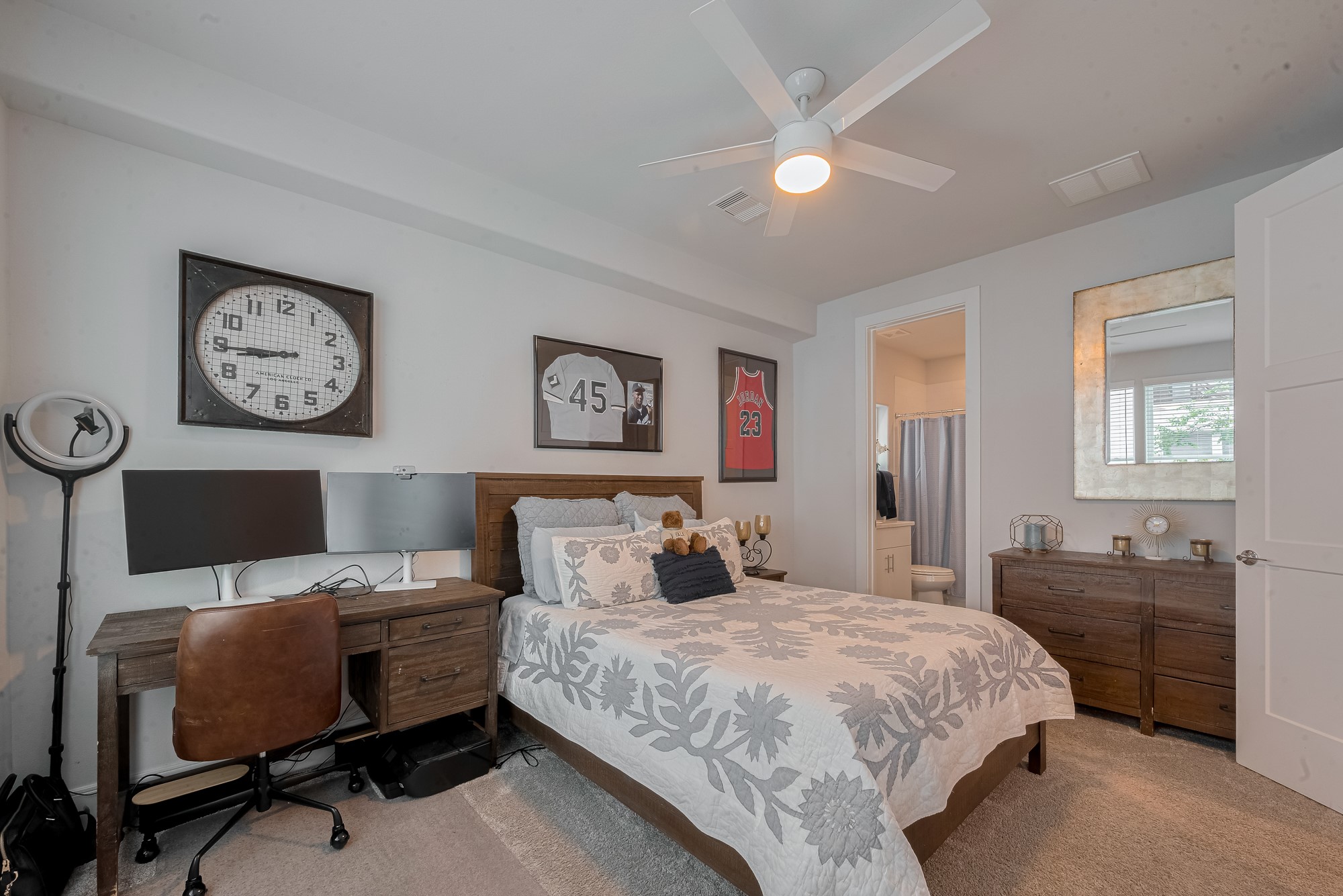 2608 Rusk Street Houston, TX 77003 - Photo 37 of 44 a bedroom with a bed and a chandelier