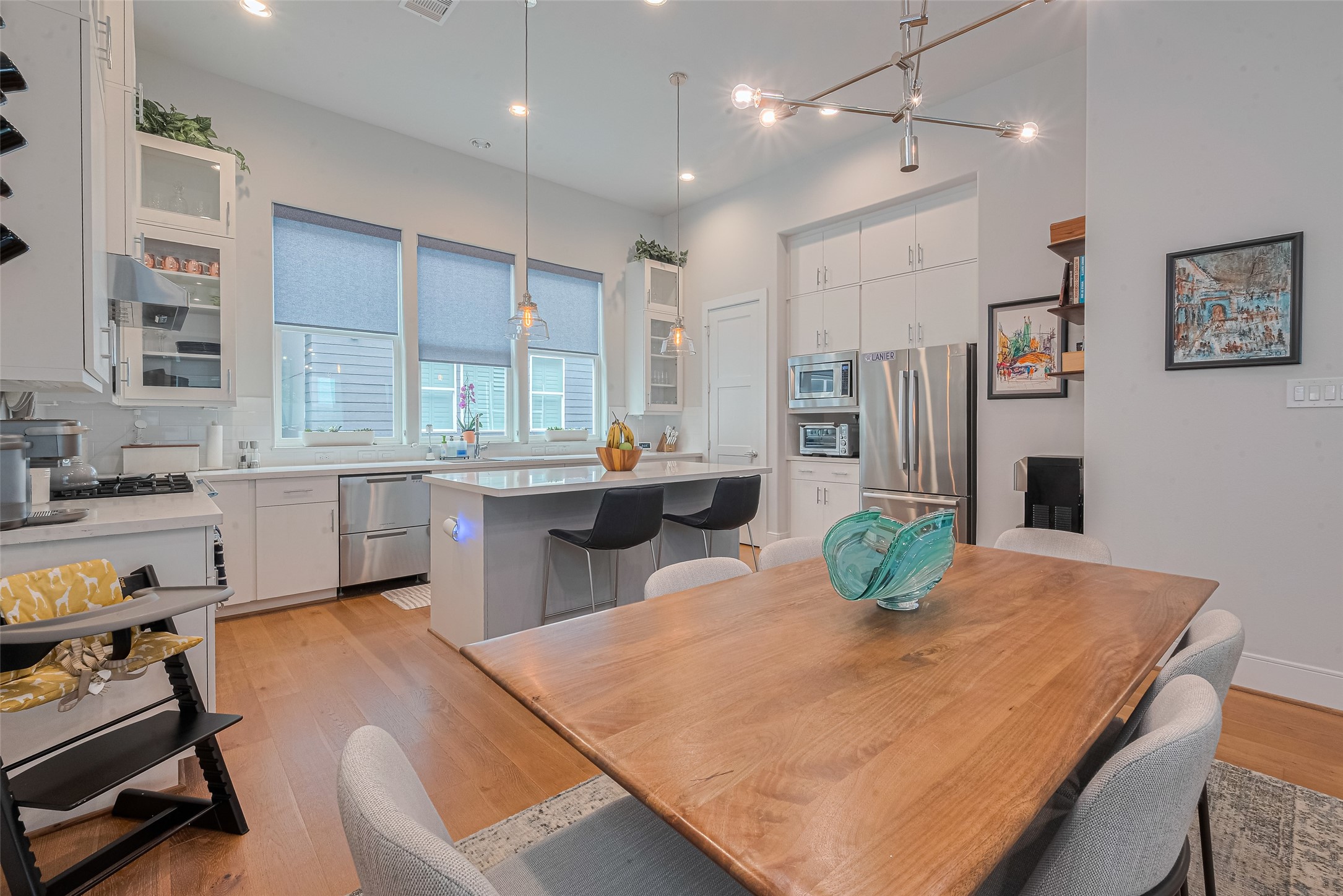 2608 Rusk Street Houston, TX 77003 - Photo 9 of 44 a kitchen with stainless steel appliances granite countertop a sink a stove a dining table and chairs