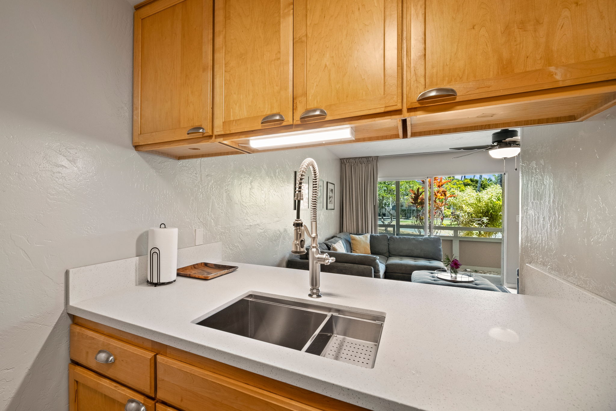 525 Aleka Loop, Unit H7 Kapaa, HI 96746 - Photo 7 of 30 a kitchen with a sink and cabinets
