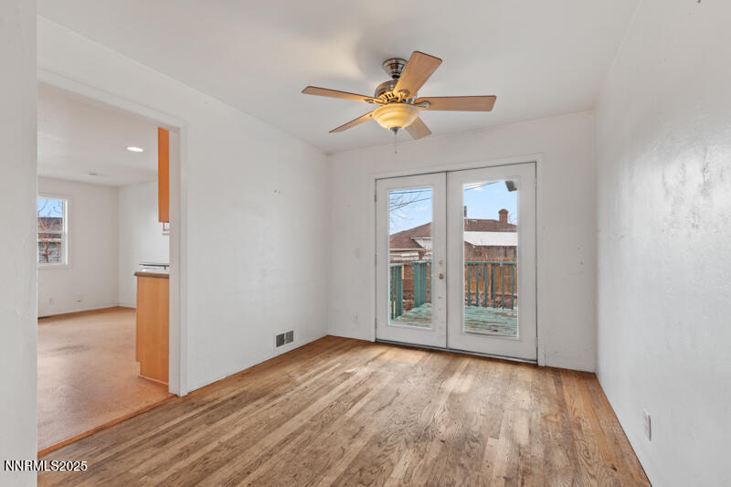 1606 Knoll Drive Reno, NV 89509 - Photo 11 of 30 wooden floor in an empty room with a window