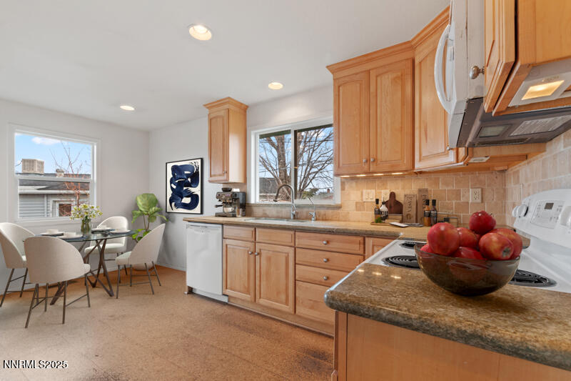 1606 Knoll Drive Reno, NV 89509 - Photo 13 of 30 a kitchen with granite countertop a sink cabinets and window