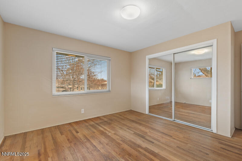 1606 Knoll Drive Reno, NV 89509 - Photo 22 of 30 an empty room with wooden floor and windows