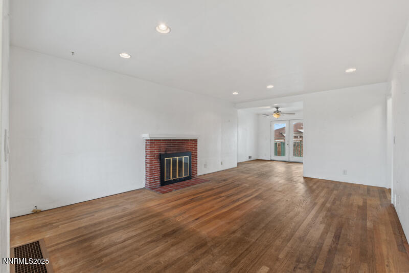 1606 Knoll Drive Reno, NV 89509 - Photo 6 of 30 a view of empty room with wooden floor and fireplace