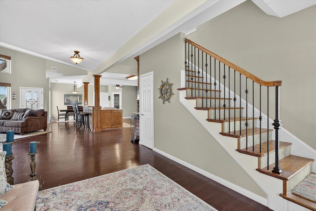 8877 Random Road Fort Worth, TX 76179 - Photo 5 of 40 a view of entryway and dining room with wooden floor