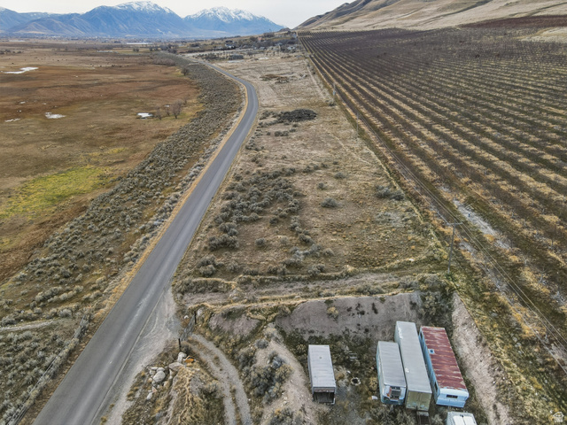 5952 South Lincoln Road Spanish Fork, UT 84660 - Photo 15 of 15 Aerial view of property's location featuring rural landscape, rows of crops, and a mountain backdrop