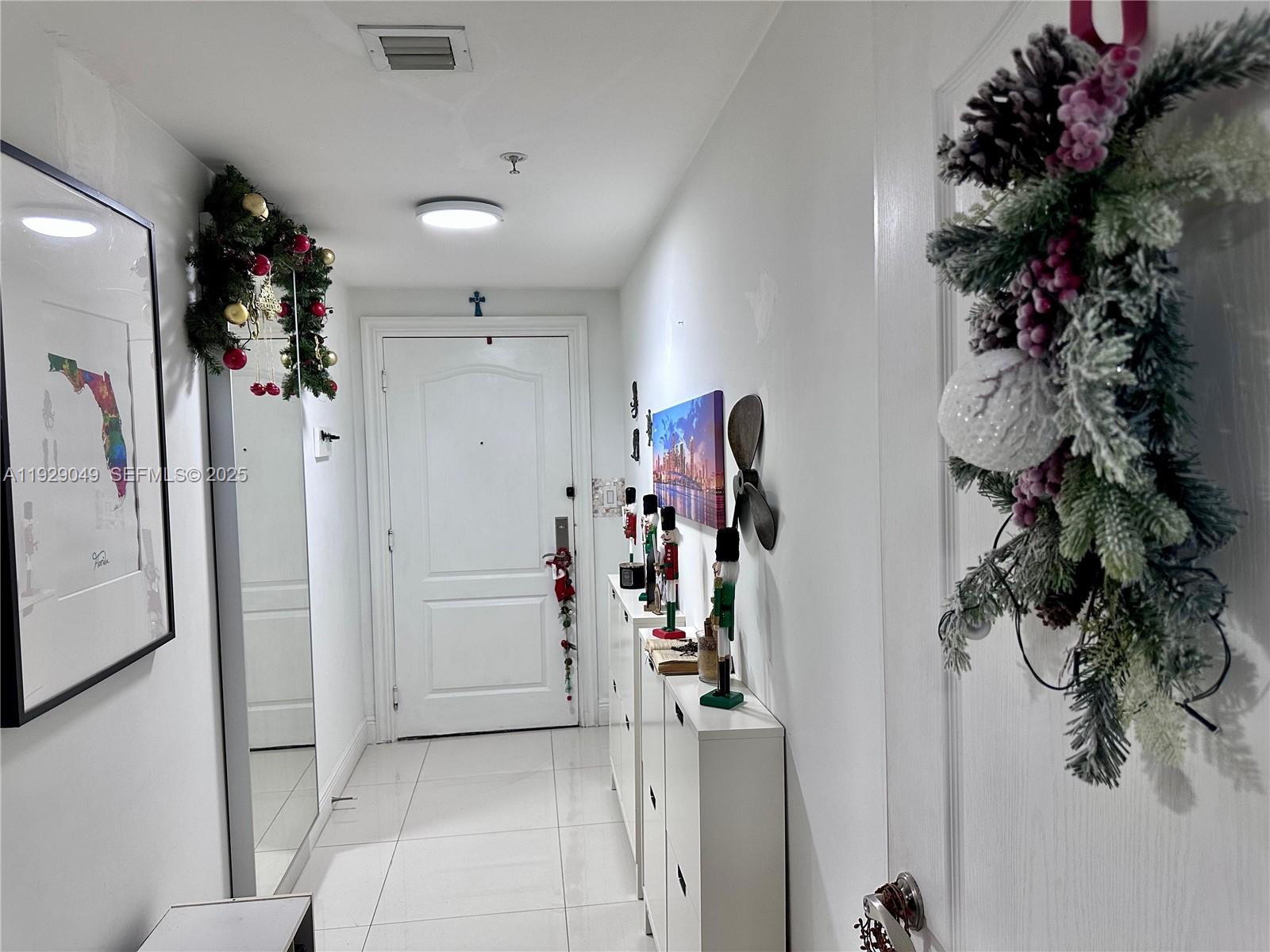 2701 Southwest 3rd Avenue, Unit 202 Miami, FL 33129 - Photo 11 of 32 a view of a hallway with a flower pot