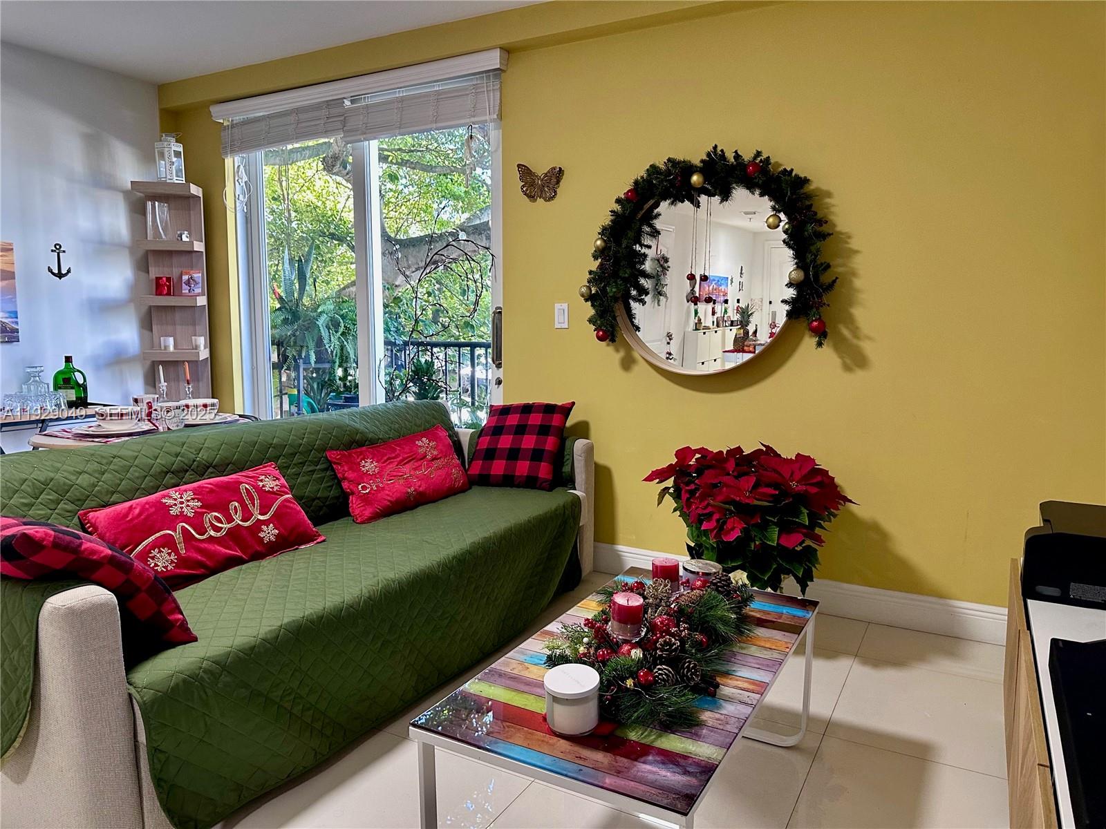 2701 Southwest 3rd Avenue, Unit 202 Miami, FL 33129 - Photo 19 of 32 a living room with furniture and a potted plant