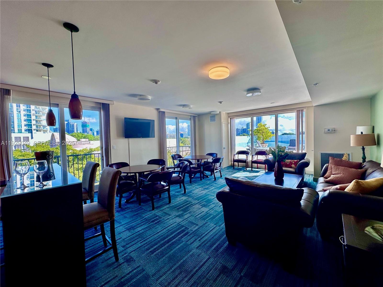 2701 Southwest 3rd Avenue, Unit 202 Miami, FL 33129 - Photo 30 of 32 a view of a dining room with furniture window and wooden floor