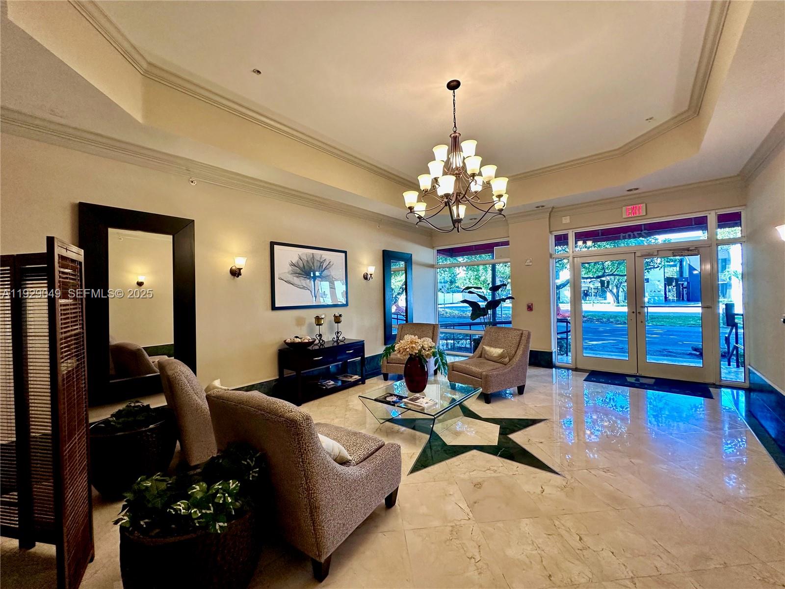 2701 Southwest 3rd Avenue, Unit 202 Miami, FL 33129 - Photo 4 of 32 a living room with fireplace furniture and a chandelier