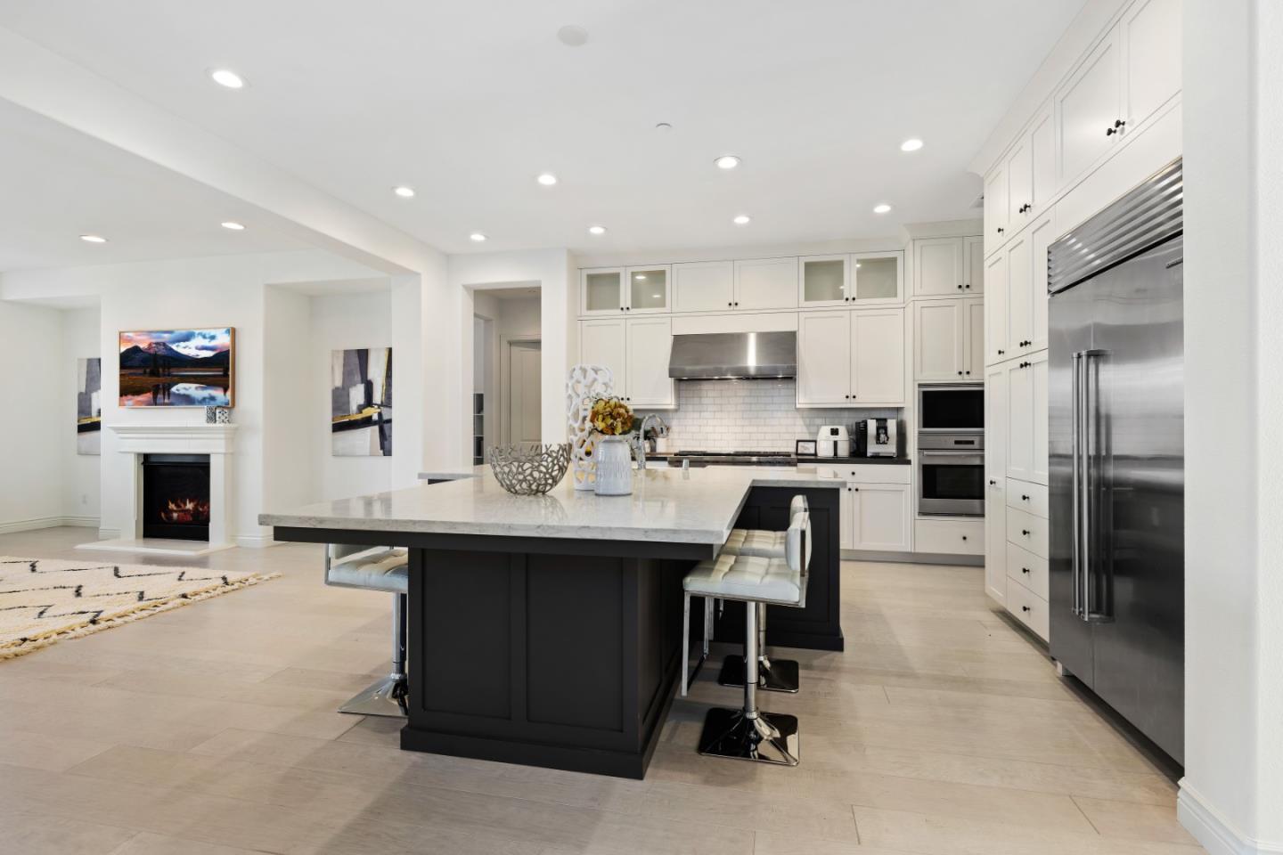 111 Dunfirth Drive Hayward, CA 94542 - Photo 12 of 49 a kitchen with stainless steel appliances kitchen island granite countertop a refrigerator oven a sink a stove and a refrigerator