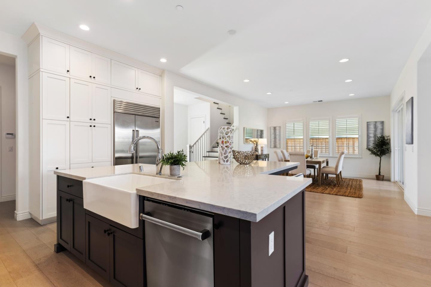 111 Dunfirth Drive Hayward, CA 94542 - Photo 16 of 49 a large kitchen with a sink and white cabinets