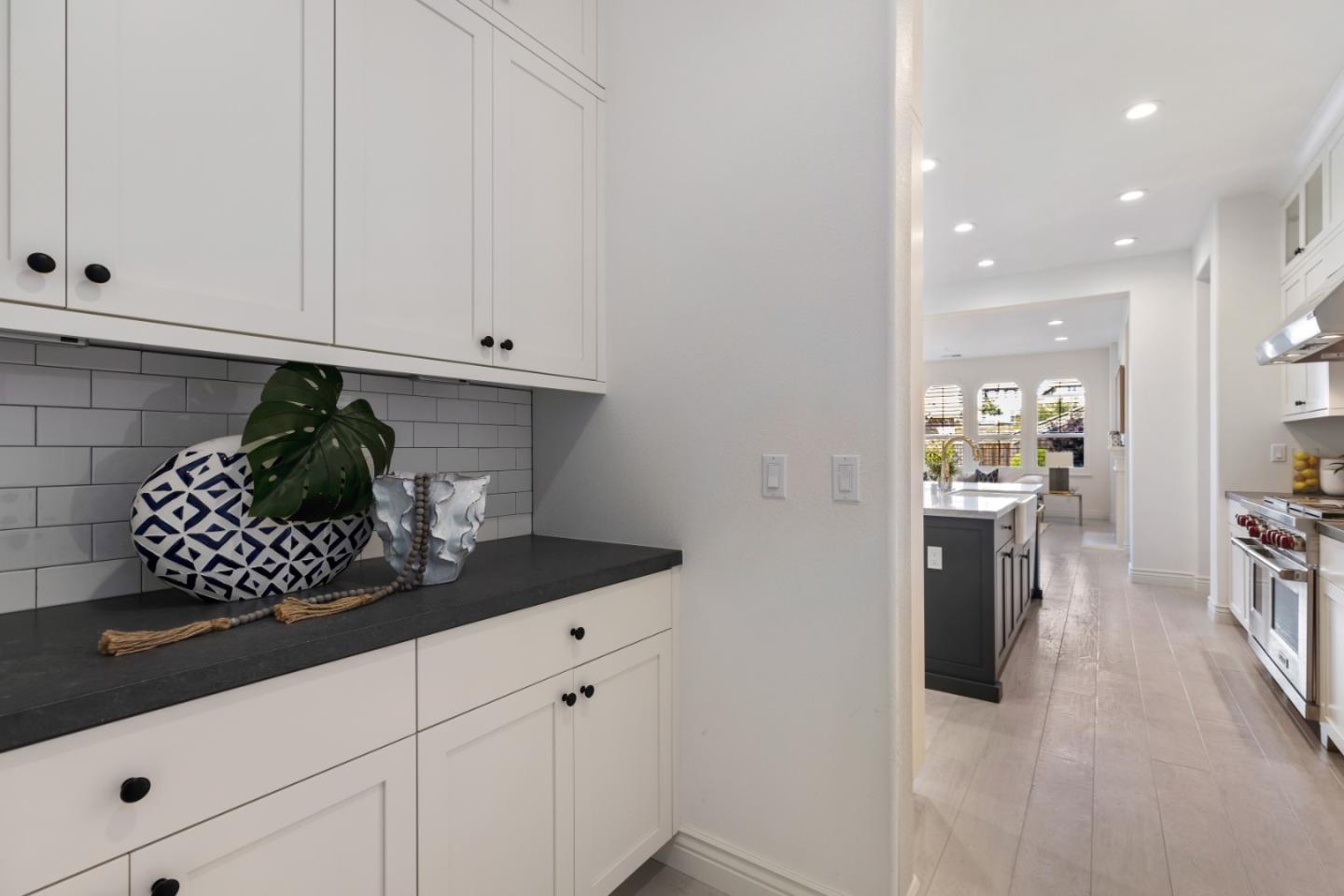111 Dunfirth Drive Hayward, CA 94542 - Photo 25 of 49 a kitchen with white cabinets and appliances