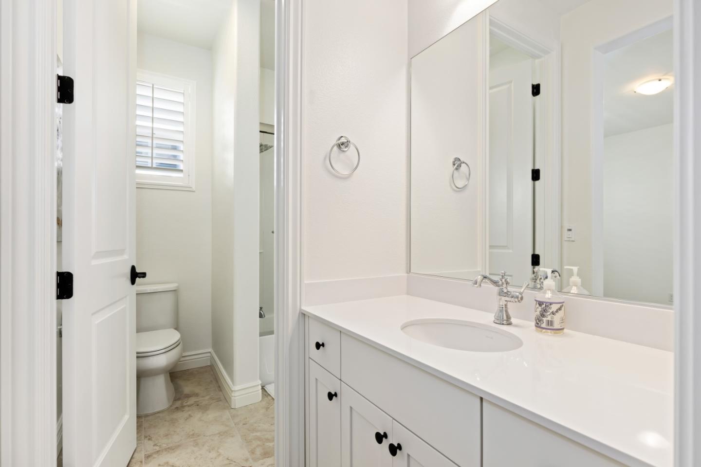 111 Dunfirth Drive Hayward, CA 94542 - Photo 40 of 49 a bathroom with a sink a toilet and a large mirror